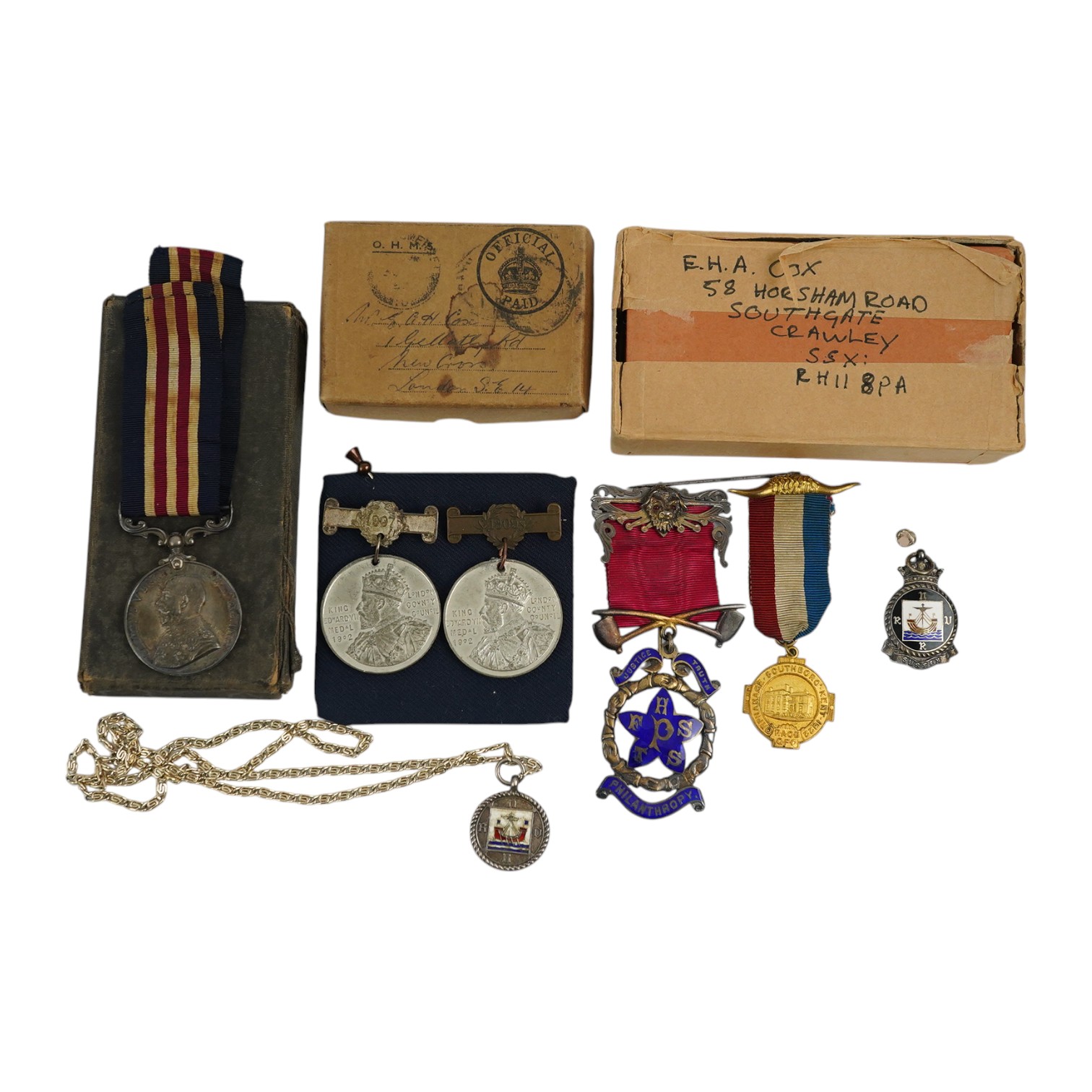 A First World War George V Bravery in the field medal awarded to CPL. R.E. Cox 11th Royal Sussex, a Second World War trio and miniatures, a Masonic medal, etc. (11). Condition - fair to good.